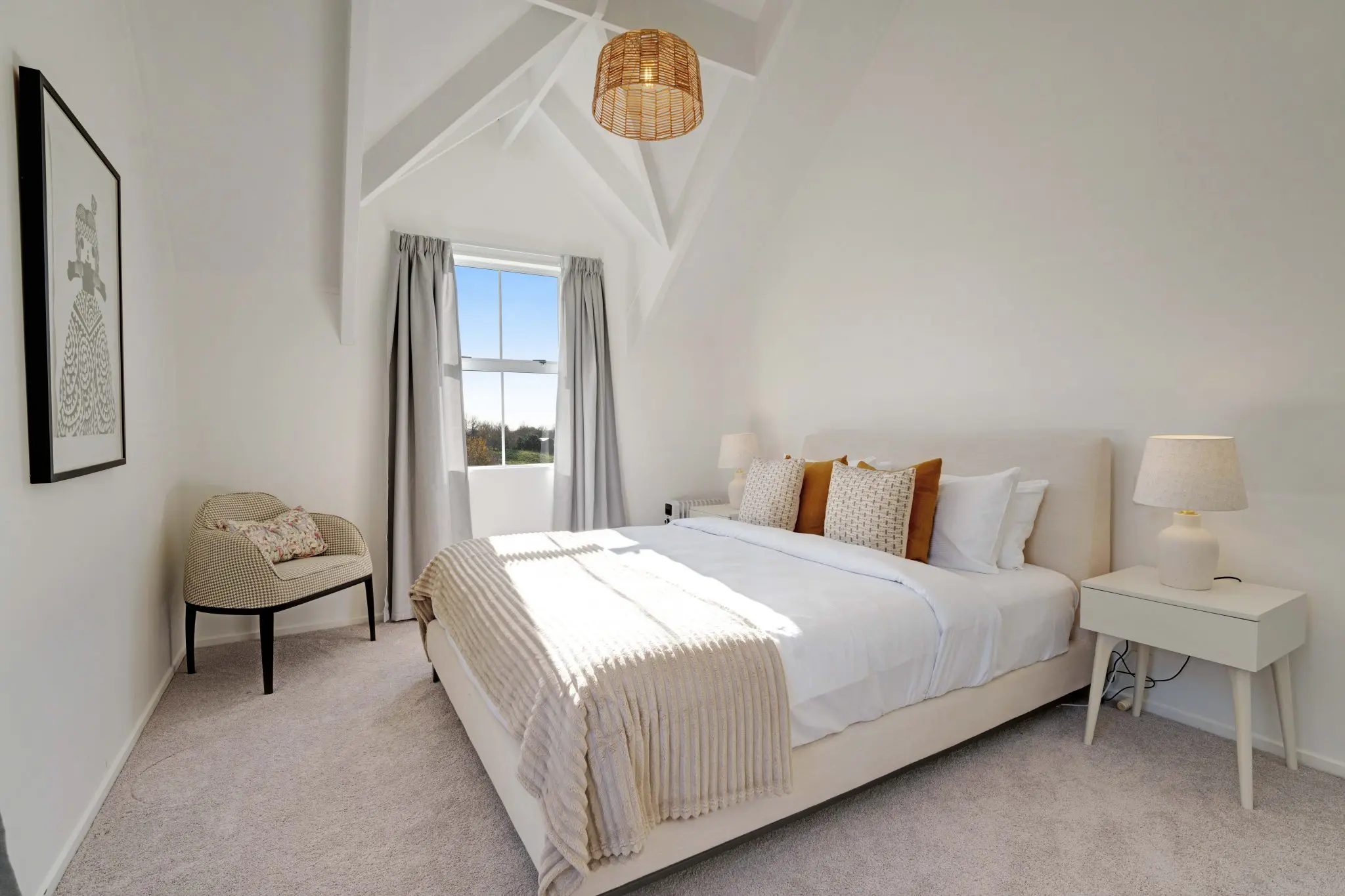 freshly made bed with white linen in an auckland short-stay home