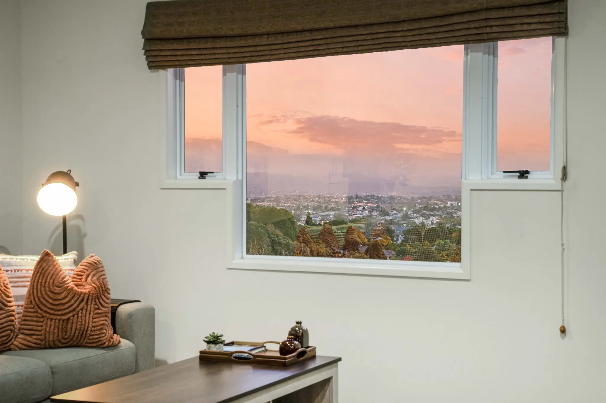 living room with sunset outside window